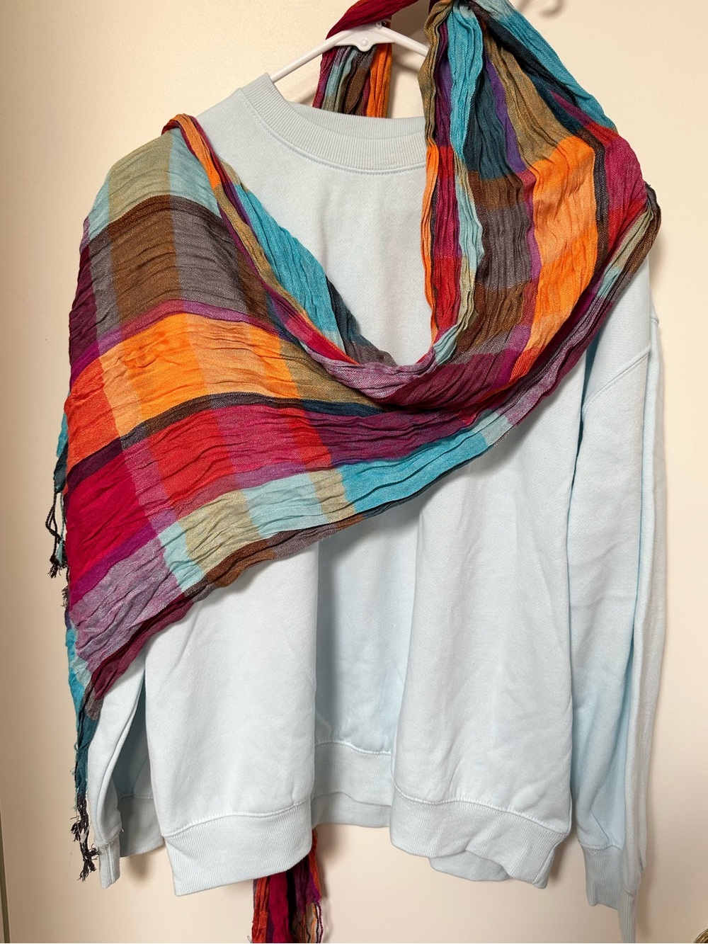 Light Blue Sweatshirt with Multicolor Striped Scarf